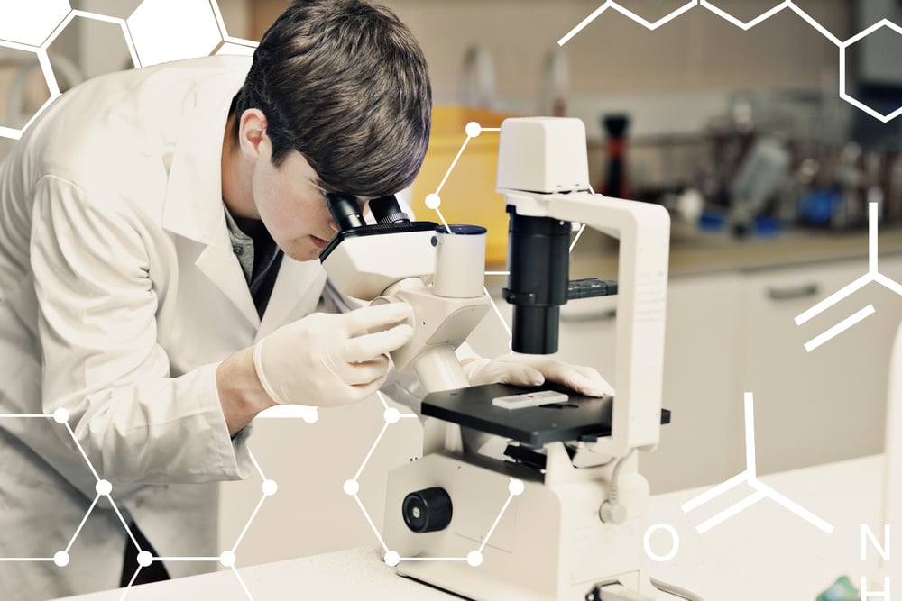 Science and medical graphic against science student looking in a microscope