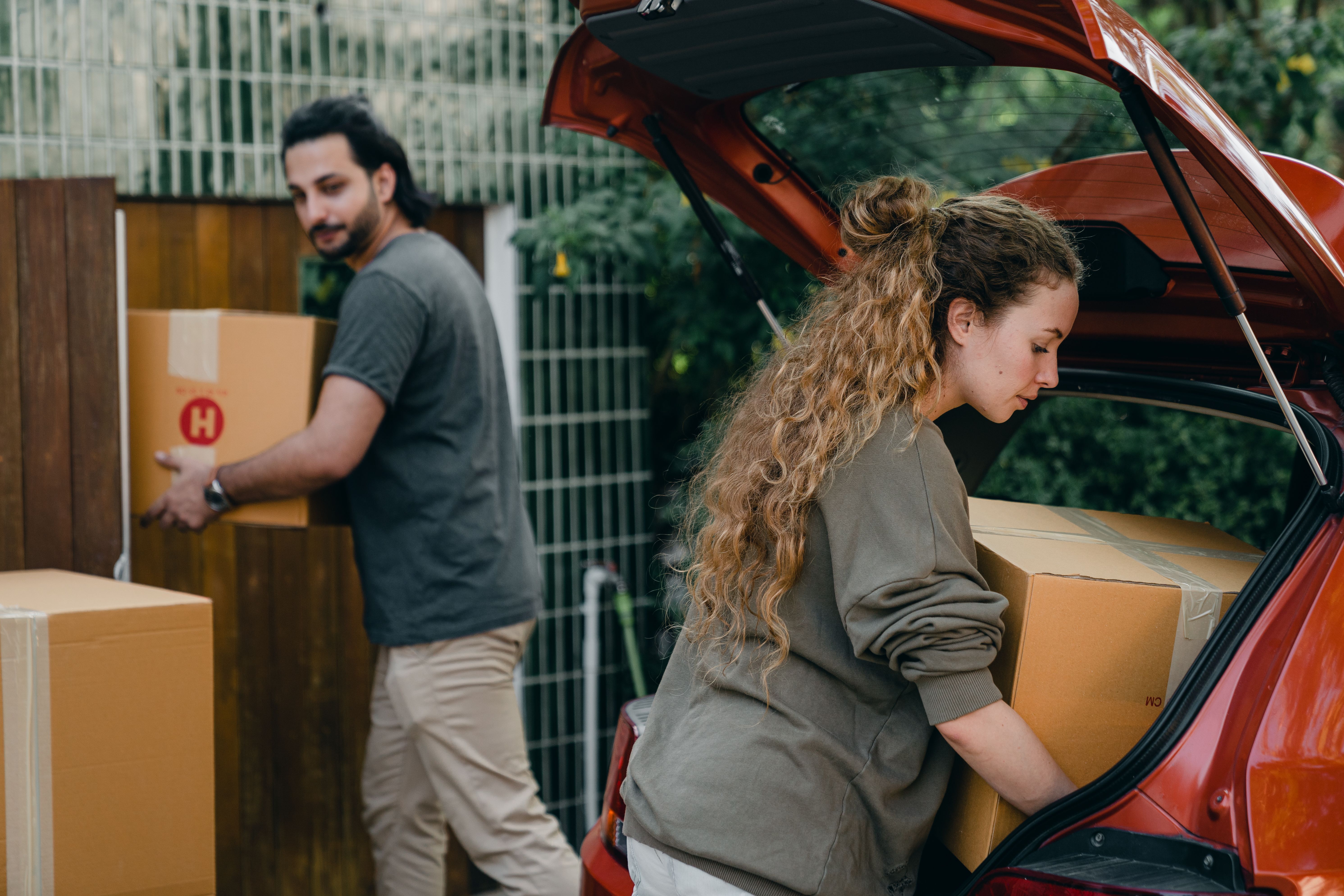 Parents unloading car for college move-in day.