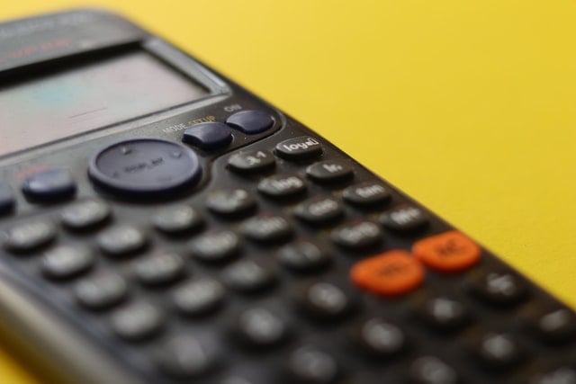 Calculator with yellow background.