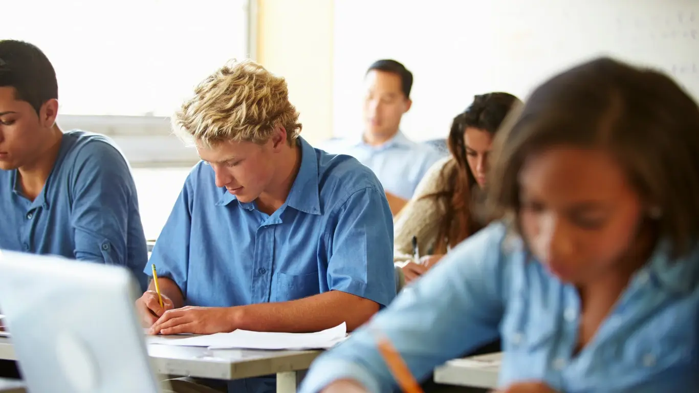 Students at their desk taking the SAT.